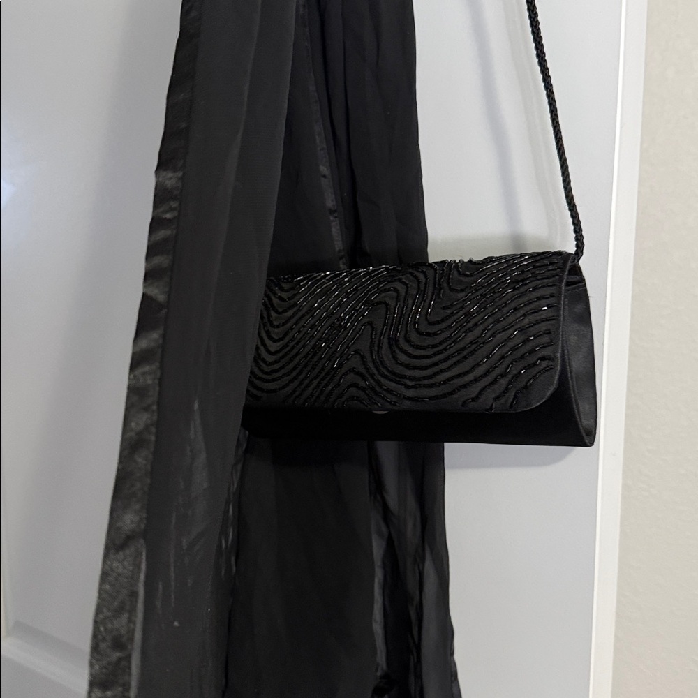 Elegant Black Beaded Evening Clutch
Plus free sheer shoulder wrap. - Picture 6 of 10